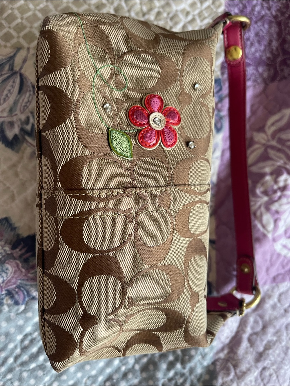 Coach Brown Signature Canvas Wristlet with Pink Flower Accent